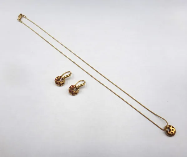 A pair of 18ct gold and ruby earrings, each with a circular front, set with circular cut rubies, suspended from a twisted wire fitting, by Dower & Hal
