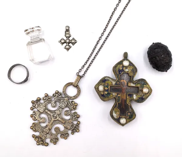 A pendant devotional icon, in a crucifix design, two Coptic Church pendant crosses, a neckchain, a carved egg shaped container, possibly coconut, cont