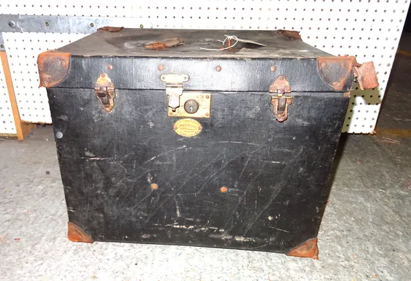 An early 20th century canvas travelling trunk and a quantity of toy train track including some trains.  S4B