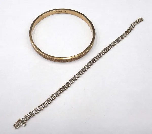 A 9ct gold and diamond set bracelet, claw set with a row of circular cut diamonds, on a snap clasp, length 19cm and a 9ct gold circular bangle, with e