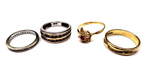 A diamond set full eternity ring, mounted with circular cut diamonds, a 9ct gold and diamond set ring in a wavy design, a white gold and diamond ring