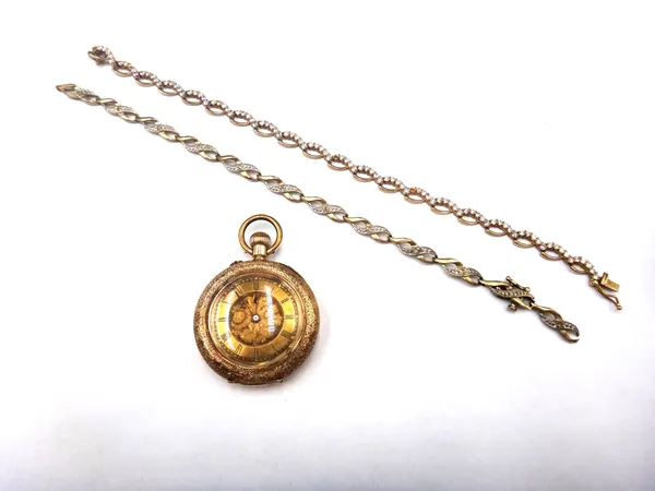 A lady's gold cased keyless wind open faced fob watch, with a gilt jewelled lever movement, the inner and outer case, detailed 18K, the gilt dial with