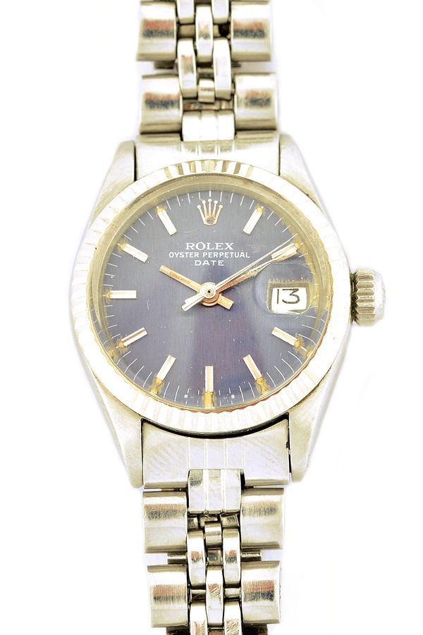 A Rolex Oyster Perpetual Date steel bracelet wristwatch, the signed blue dial with baton shaped numerals, centre seconds and with a date of the month