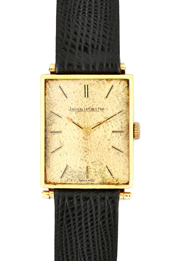A Jaeger-Le Coultre gold rectangular cased gentleman's wristwatch, the signed textured dial with baton shaped numerals, detailed to the caseback 11820