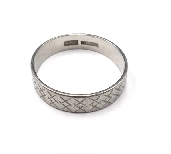 A platinum wide band wedding ring, with engraved decoration, detailed PLATINUM, ring size V and a half, weight 5.9 gms.