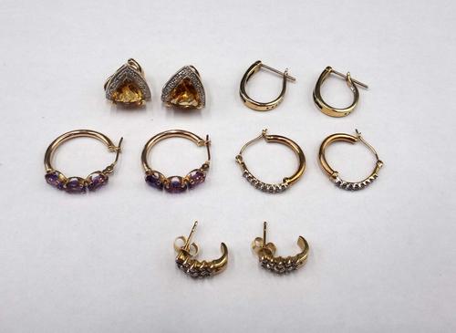 A pair of gold, citrine and diamond set earrings, in a curved triangular design, the backs with post and folding clip fittings, a pair of gold, sapphi