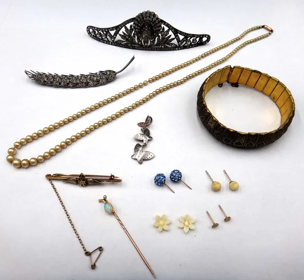 A gold and enamelled R.A.F bar brooch, detailed 14 CT, a gold, opal and seed pearl stick pin, a colourless paste set hair comb fitting, with a peacock