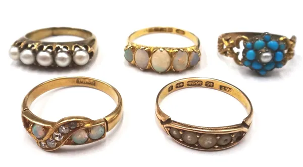 An 18ct gold ring, mounted with a row of five oval opals, graduating in size to the centre stone, Birmingham 1902, a gold ring, mounted with a row of
