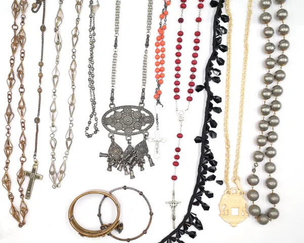 A collection of mostly costume jewellery, including; a silver pendant cross, part of a moonstone bar brooch, bead and other necklaces, bangles, a few
