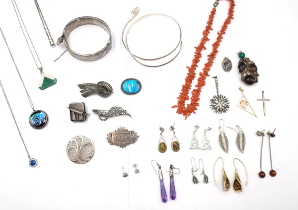 A group of silver and other jewellery, comprising; two bangles, six brooches, eight pairs of earrings, a branch coral necklace, five pendants, three p