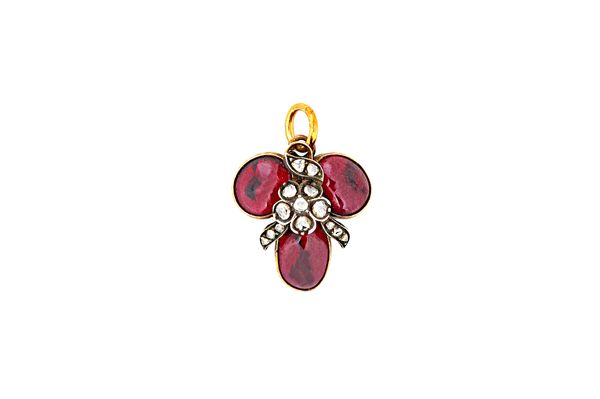 A Victorian rose diamond and carbuncle garnet pendant, circa 1850, formed as a trefoil centred by a rose diamond set floral spray motif, the back glaz