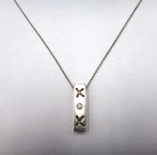 A Tiffany & Co Paloma Picasso silver and diamond set single stone pendant necklace, of rectangular form, mounted with a circular cut diamond, between