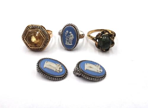 A gold and citrine single stone ring, mounted with a hexagonal cut citrine, within a wirework surround, a 9ct gold band ring, having a gilt metal and