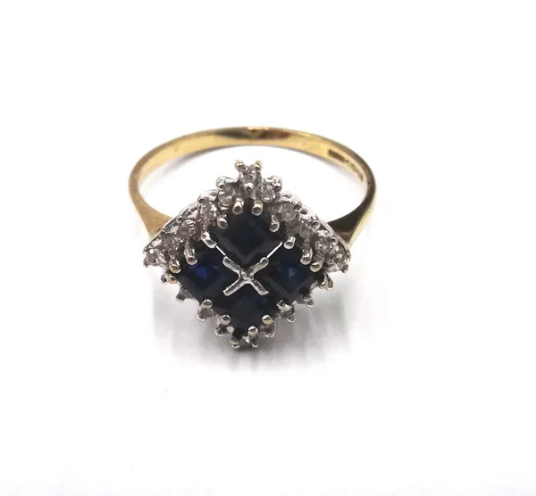A 9ct gold, sapphire and diamond square cluster ring, claw set with four square cut sapphires and with a surround of circular cut diamonds, ring size