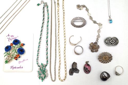 A 14ct white gold, blue topaz and diamond set pendant, with a white gold neckchain, detailed 14 K, a green and colourless paste costume necklace and f