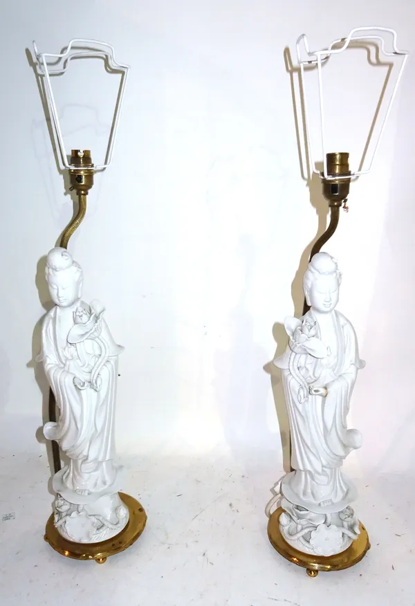 A pair of 20th century white porcelain Chinese figural table lamps, (2) 66cm high.  F9