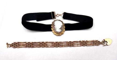 A gold bar and oval link gate bracelet, with a gold heart shaped padlock clasp, detailed 9 CT, weight 13.5 gms and a 9ct gold mounted oval shell cameo