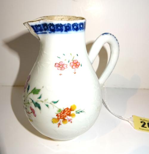 A Chinese export pear shaped famille-rose milk jug, Qianlong, enamelled with flower sprays beneath an underglaze-blue cell pattern border, (a.f), 11.5