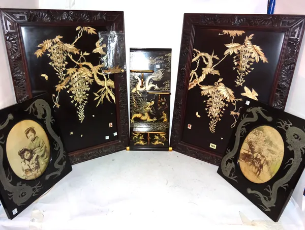 A pair of Japanese lacquer and bone panels, circa 1900, depicting birds amongst branches of wisteria,  60cm. by 38cm., carved wood frames; also a pair