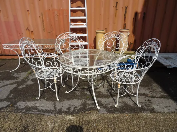 A 20th century white painted metal circular garden table with a matching set of four white metal peacock garden chairs, 92cm wide x 74cm high, (5).  O