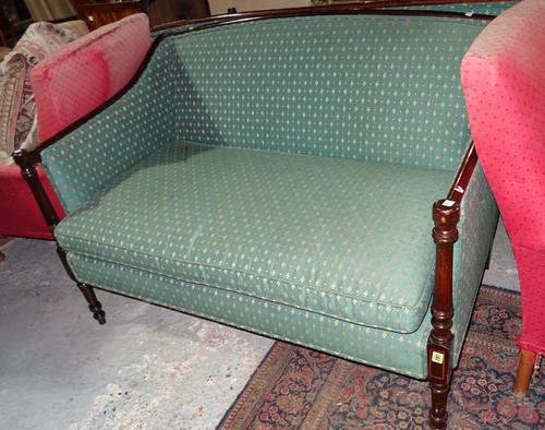 A Regency style mahogany show frame sofa with downswept arms and turned supports, 126cm wide x 85cm high.  BAY 2