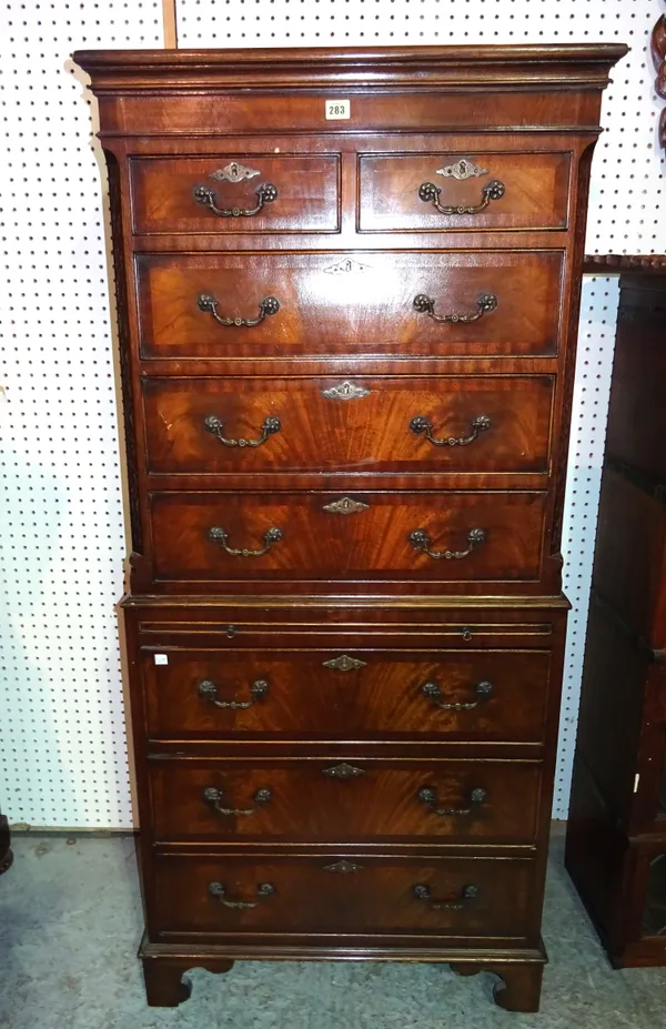 A 20th century mahogany chest on chest with two short over six long drawers on bracket feet, 70cm wide x 148cm high.  M5