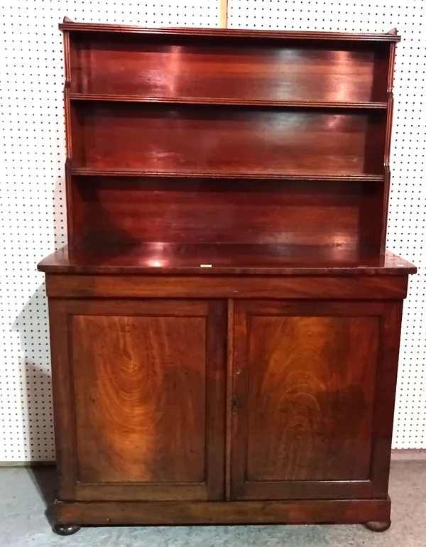 A 19th century mahogany bookcase cabinet with single frieze drawer over panelled doors on bun feet, 110cm wide x 161cm high.  M5