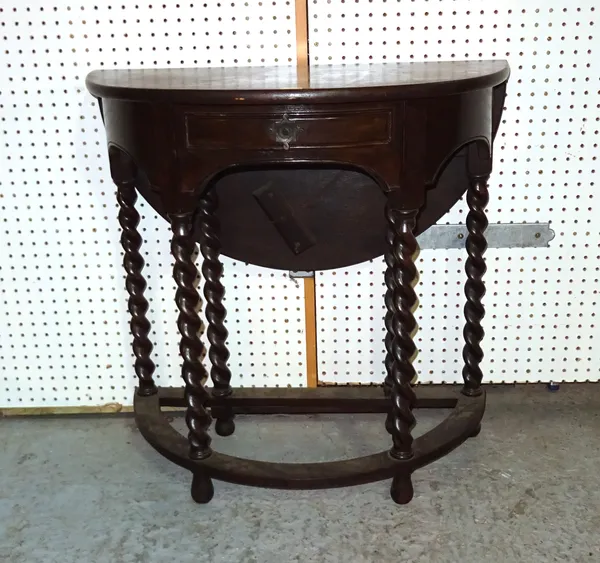 An 18th century style oak bowfront single drawer drop flap side table on barleytwist supports, 76cm wide x 76cm high.  BAY 1
