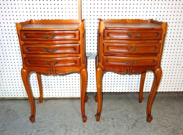 A pair of Louis XVI style mahogany bedside tables with three drawers and galleried top, 40cm wide x 70cm high  (2).   BAY 3