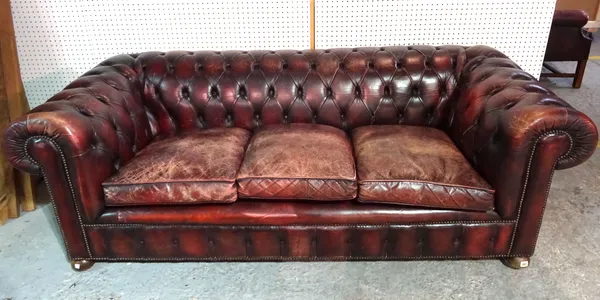 A 20th century mahogany framed Chesterfield sofa with red leatherette button back upholstery, 210cm wide.  L4