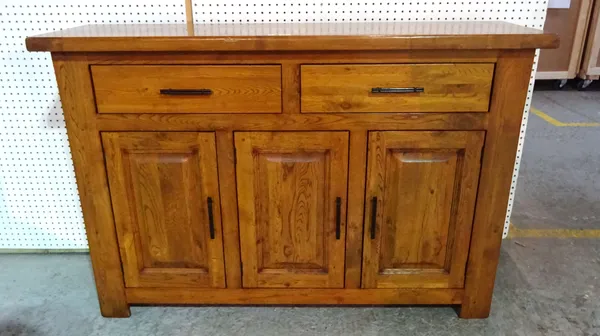 A 20th century hardwood sideboard with two short drawers over a three door cupboard base, 140cm wide x 96cm high.  H5
