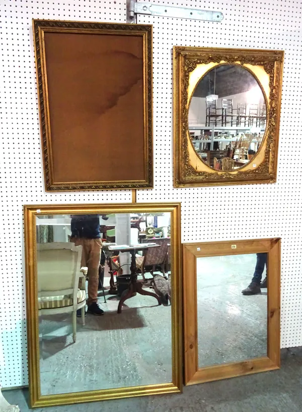 A 20th century gilt framed rectangular mirror, 87cm wide x 115cm high, a 20th century gilt framed oval mirror 66cm wide x 76cm high, a gilt mirror and