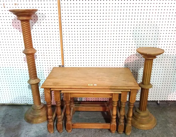 A 20th century pine nest of three tables, the largest 76cm wide x 46cm high, an oak jardiniere stand on twisted column, 100cm high and a pine jardinie