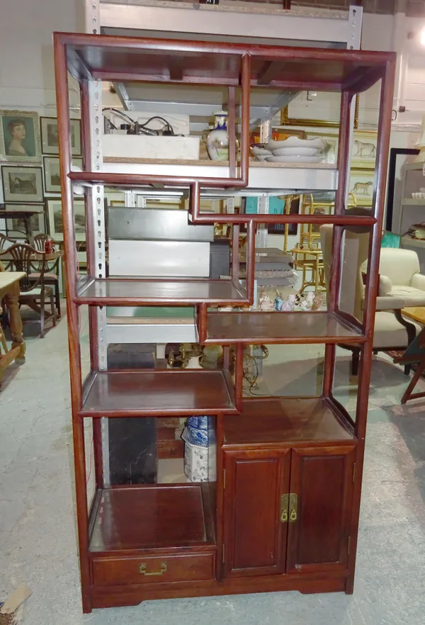 An early 20th century Chinese multi-tier shelf with single drawer and cupboard, 91cm wide x 173cm high x 38cm deep.   BAY 2