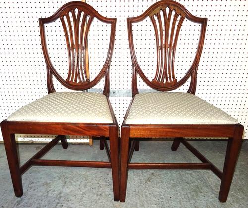 A set of six George III mahogany shield back dining chairs on square tapering supports, (6).  BAY 2