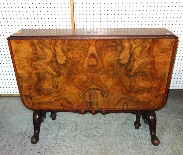 A Victorian walnut Sutherland table on ring turned pad supports, 91cm wide x 66cm high.   C8