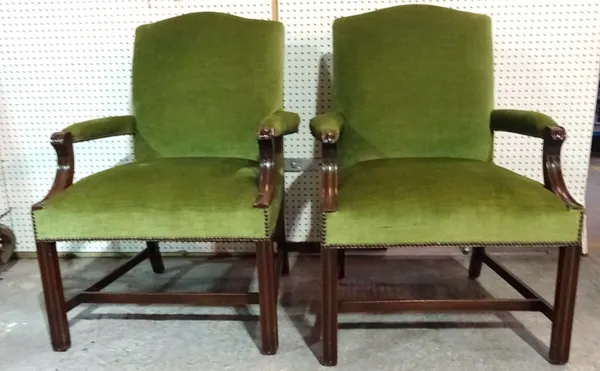 A pair of George III style mahogany open armchairs with green upholstery on square block supports, (2). H4