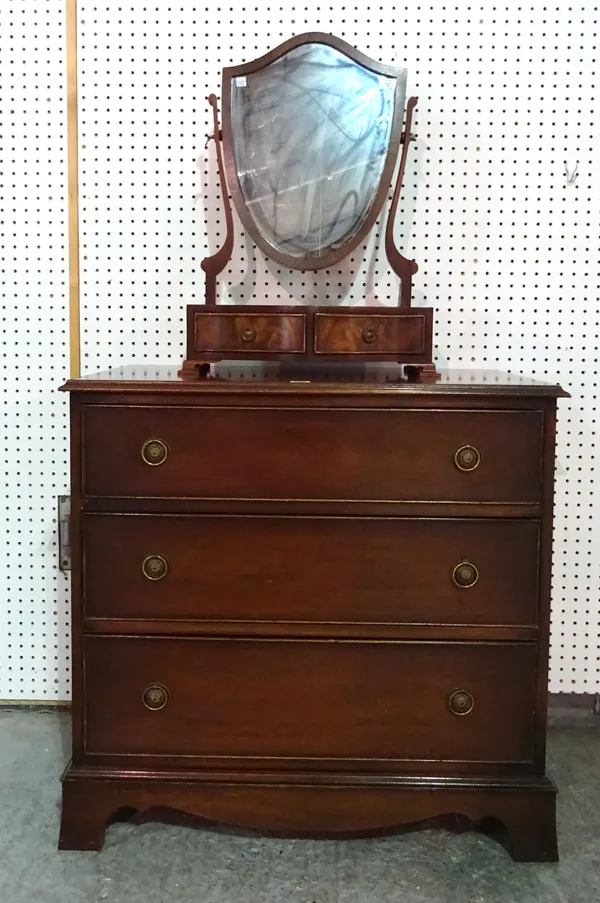 A 20th century mahogany chest of three long drawers on bracket feet, 80cm wide x 76cm high and a 20th century mahogany bowfront toilet mirror 44cm wid