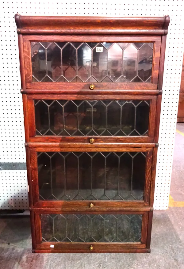 The Globe-Wernicke Co Ltd; an oak four section bookcase, with leaded glazed doors, 68cm wide x 125cm high.  M4