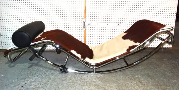 A 20th century chrome and cow hide chaise longue, lacking base, 150cm wide.   H8