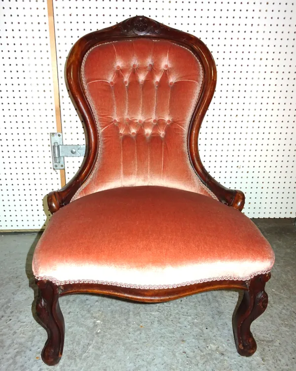 A Victorian mahogany framed low armchair with pink button back upholstery, 56cm wide.  D3