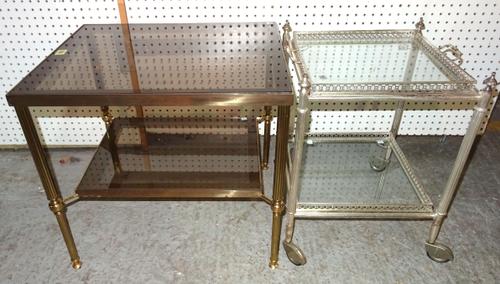 A 20th century brass two tier occasional table with smoked glass on fluted tapering supports, 56cm wide x 51cm high and a 20th century silver metal tw