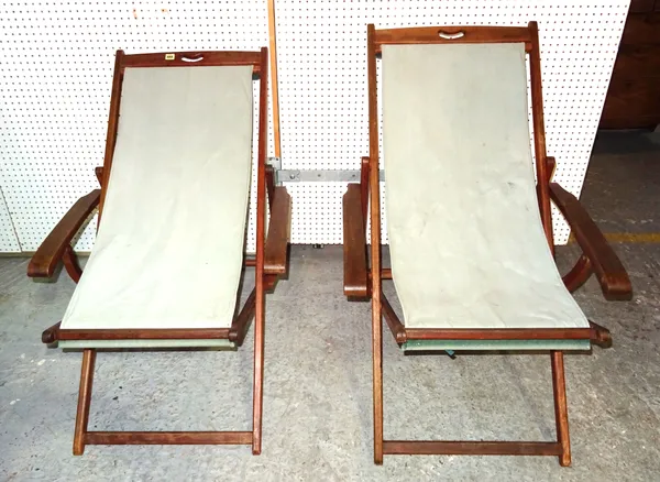 A pair of 20th century hardwood framed deck chairs, (2).   OUT