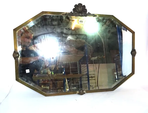 A 20th century octagonal brass framed mirror, 78cm wide x 62cm high.   E10