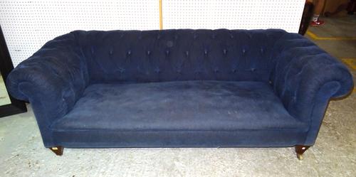 A 20th century mahogany framed Chesterfield sofa, with button back blue upholstery on tapering square supports, 210cm wide.   C8