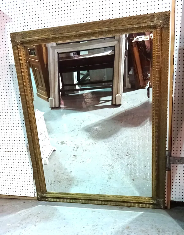 A large 20th century rectangular gilt framed mirror, 110cm wide x 145cm high.   C10