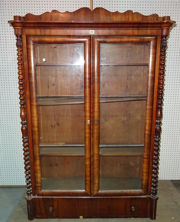 A Victorian rosewood bookcase with single drawer to base flanked by bobbin turned column, 112cm wide x 105cm high.  B10
