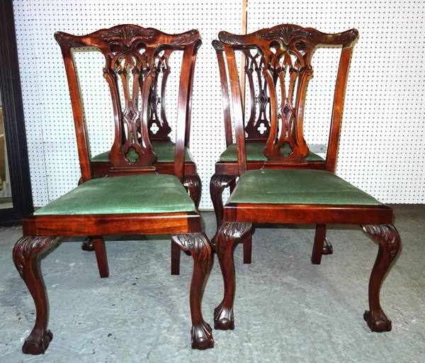 A set of four George III style mahogany dining chairs on ball and claw feet, (4).  F4