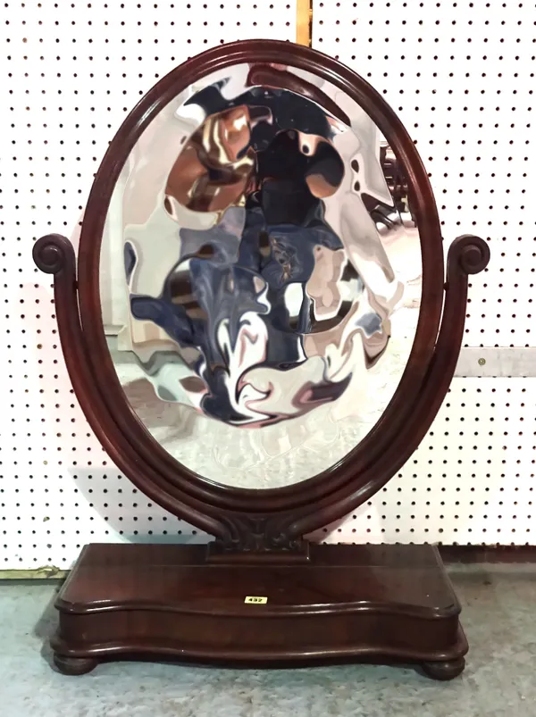A Victorian mahogany serpentine dressing table mirror on pad feet, 59cm wide x 76cm high.  A7