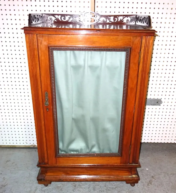 An early 20th century mahogany and walnut music cabinet with fret cut galleried top, 59cm wide x 87cm high.   G7